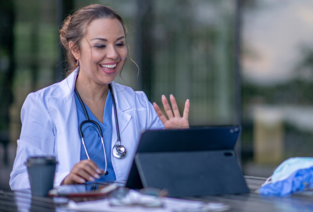 Happy medical professional that feel less stressed because AI helps delivering effective care