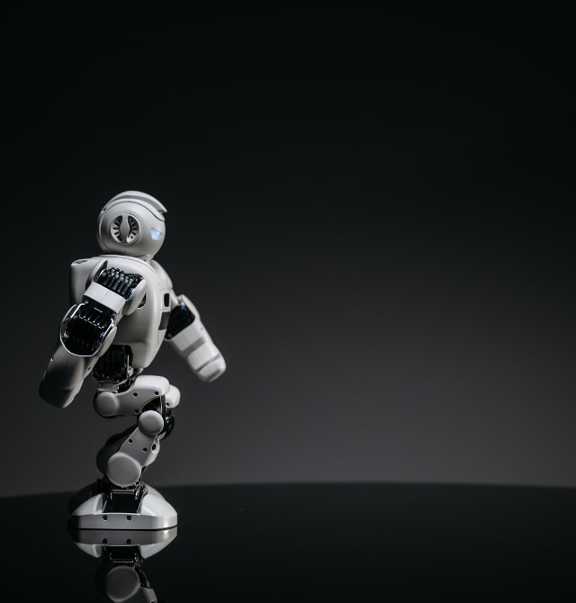 a small robot on the black background